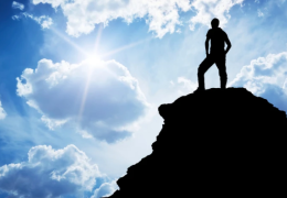 Person at the top of a mountain.