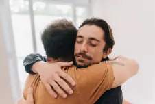 Father and son embracing