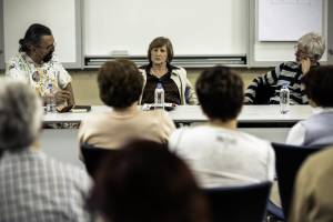 People having a discussion around a conference table