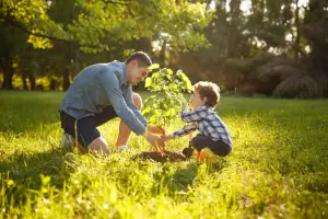 Father and son planting a tree