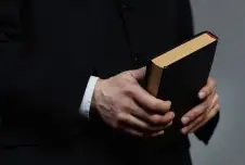 Hands holding a Bible
