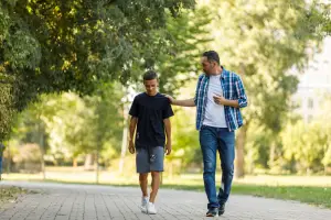 Father and son walking in the park