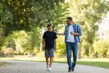 Father and son walking in the park