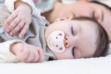 Mother and infant sleeping side by side