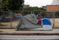 Tent belonging to an unhoused person on the side of the road