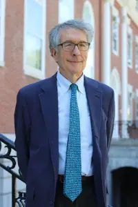 Howard Gardner standing in front of a building