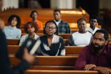 People sitting in church listening to sermon