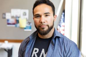 Serious man with an Army shirt on