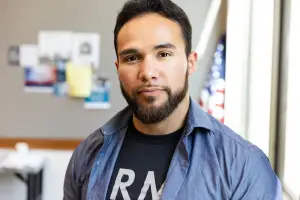 Serious man with an Army shirt on