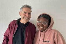 Older man and young student smiling together for the camera