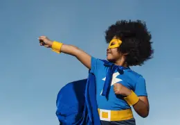 A child in a superhero outfit.