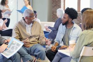 Group of community members sitting down for a discussion