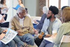 Group of community members sitting down for a discussion