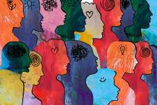 Group of different-colored heads with different symbols in each representing thoughts